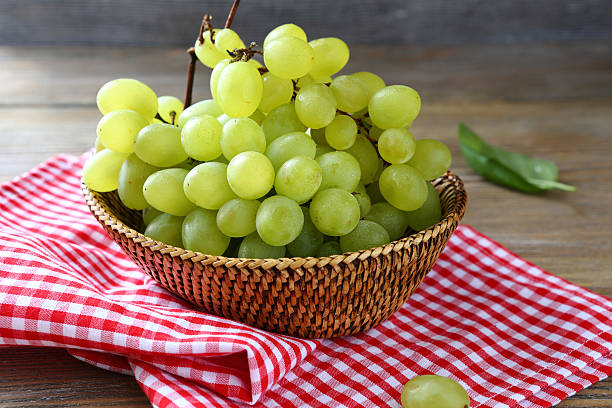 istock bunch of ripe grapes in a basket 518499379