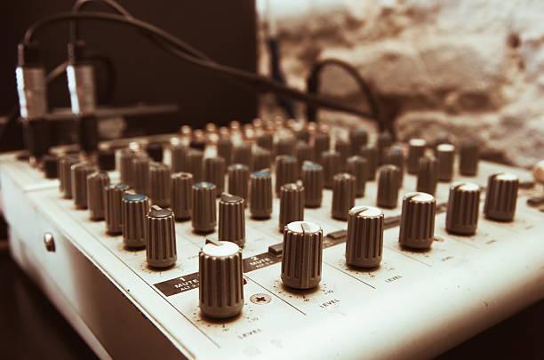 istock old used musical mixer closeup 518499676