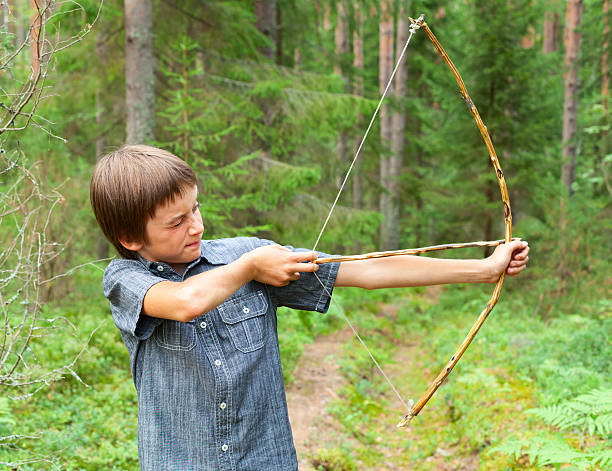 istock Kid with homemade bow and arrow 518500183