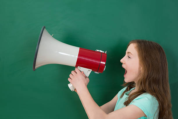 istock Girl Announcing On Megaphone 518500656
