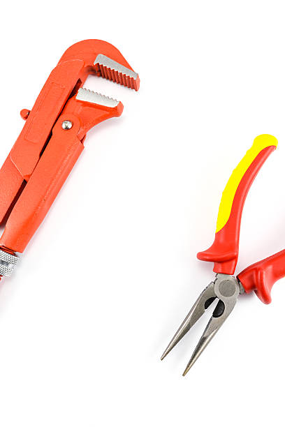 istock red wrench and pliers 518501326