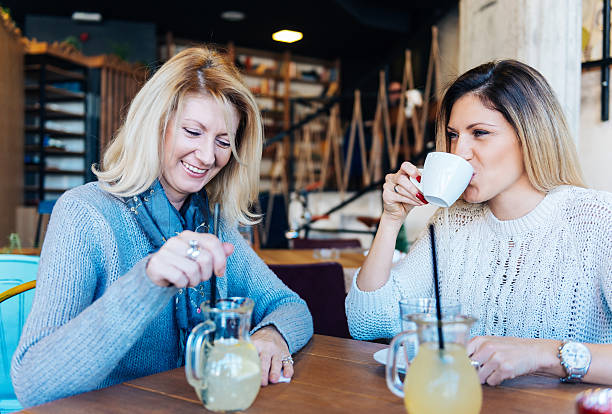 istock Two women chatting and having coffee break in cafe 518501514