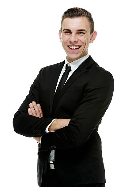istock Cheerful businessman standing with arms crossed 518501623