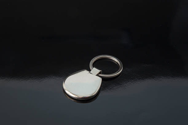 istock silver metal keychain on black background 518501914
