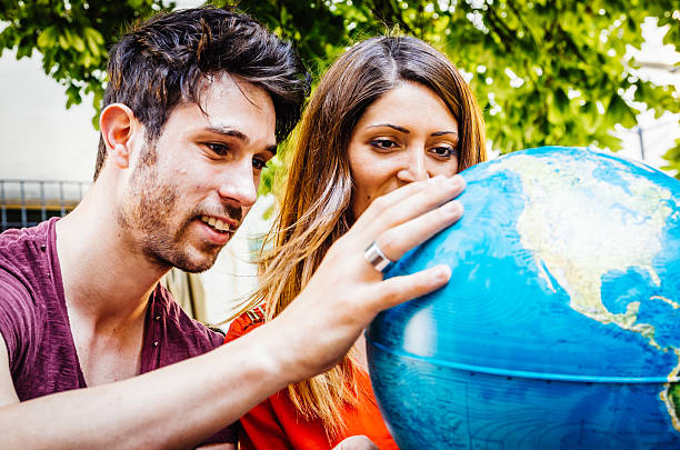 istock Young Couple Thinking About Where To Go On Trip 518501977
