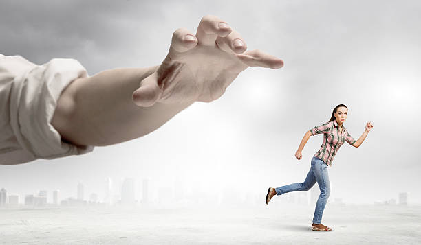 istock Woman escape from hand 518502315