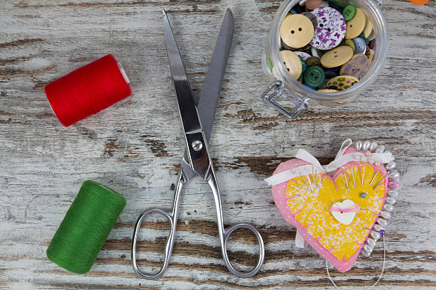 istock Sewing tools in a wooden background 518503335