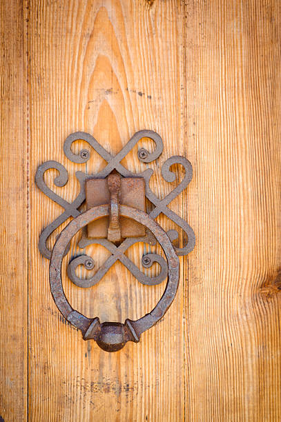 istock The detail of old large oak door with iron pull 518503511