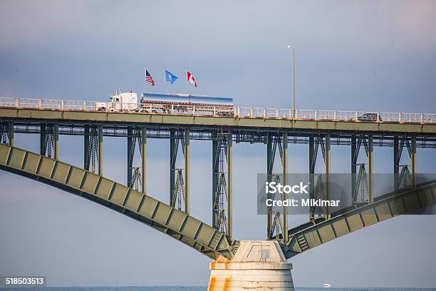Traffic Crossing Peace Bridge At United States Canada Border Flags Stock Photo - Download Image Now