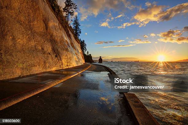 Seawall And Rock Wall At Sunset Stock Photo - Download Image Now - Awe, Back Lit, Beach