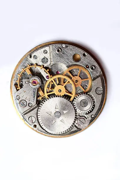 The clock mechanism on a white backgroundThe clock mechanism on a white background