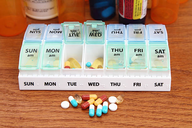 istock Medicine pill box daily planner with medicines 518503957
