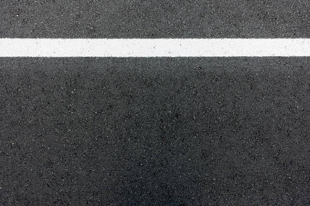 istock background texture of rough asphalt road 518504045
