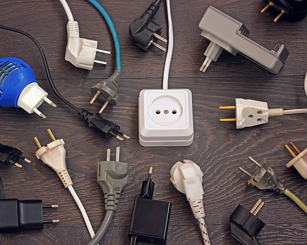 istock Power outlets and multiple plugs from electronic devices, top view. 518504120