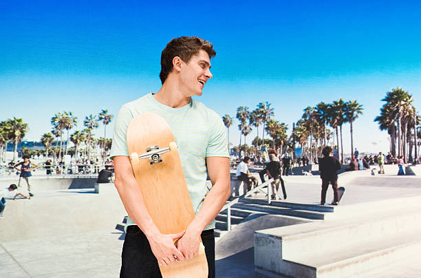 istock Skateboarder holding skateboard in outdoor 518504968