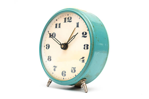 istock Old mechanical alarm clock on white background 518505136