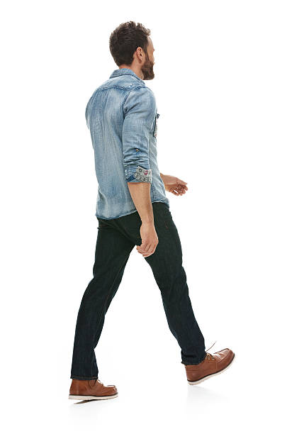 istock Rear view of casual man walking 518505346