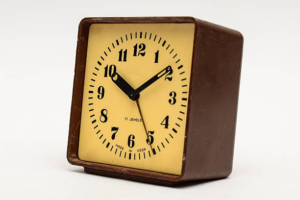 istock Brown square alarm clock on a white background 518505692