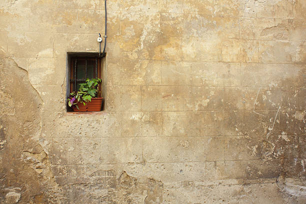 istock Old window on an stone wall of a fortress 518508536