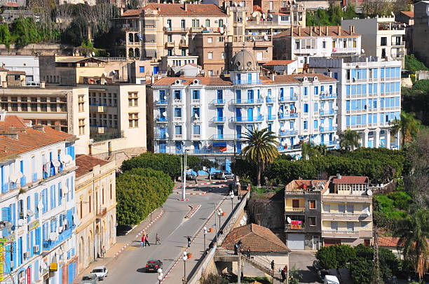 Bejaia, Algeria - January 26, 2008: people and cars on the sea front street - Rue des Oliviers
