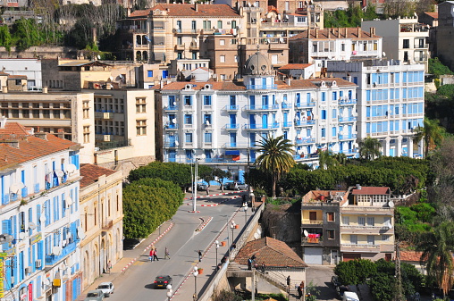 Bejaia, Algeria - January 26, 2008: people and cars on the sea front street - Rue des Oliviers