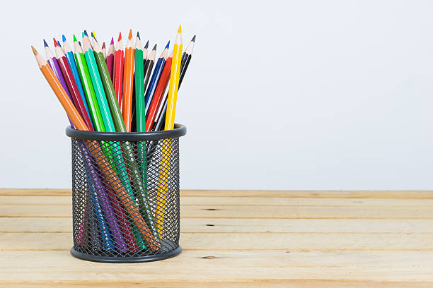 istock Colored pencils in a pencil case on white background 518522020