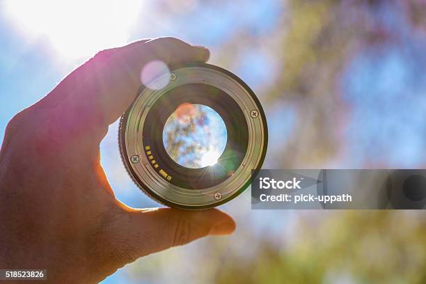 Photographer Holding Up Lens Stock Photo - Download Image Now - Lens - Optical Instrument, Looking Through Window, Looking At View