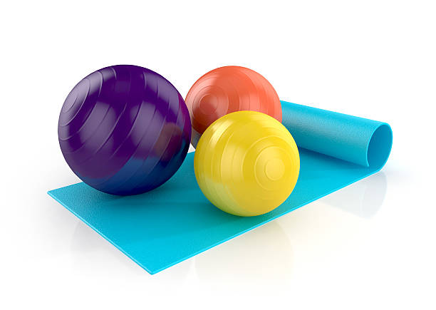 istock blue exercise mat with colorful fitness balls 518524185