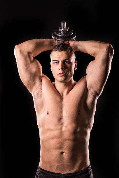 bodybuilder - human muscle men weights picking up foto e immagini stock