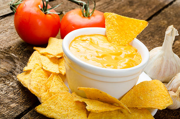 istock Tortilla chips with tomato and cheese-garlic dip 518524319