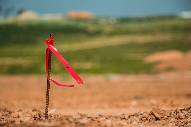 istock Metal survey peg with red flag on construction site 518524676