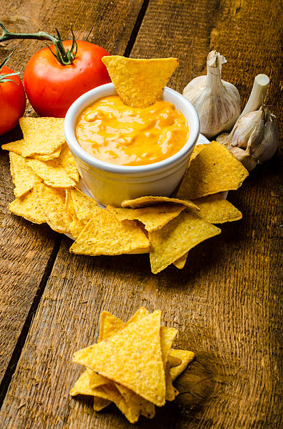istock Tortilla chips with tomato and cheese-garlic dip 518524729