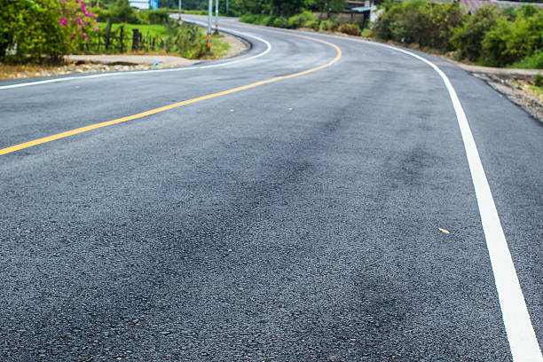 istock New asphalt texture yellow white line 518524801