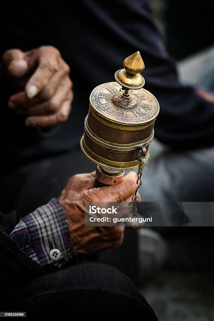 Hands Of A Tibetan Buddhist With His Prayer Wheel Stock Photo - Download  Image Now - Prayer Wheel, Tibet, Asia - iStock