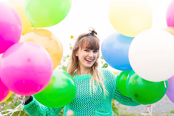 istock girl with balloons 518525227
