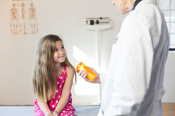 istock Hispanic Girl's Pediatrician Visit, Medication 518525688