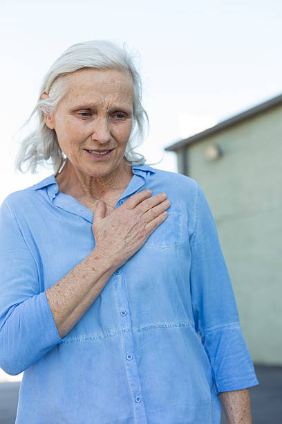 istock Senior Woman with Chest Pains 518526298