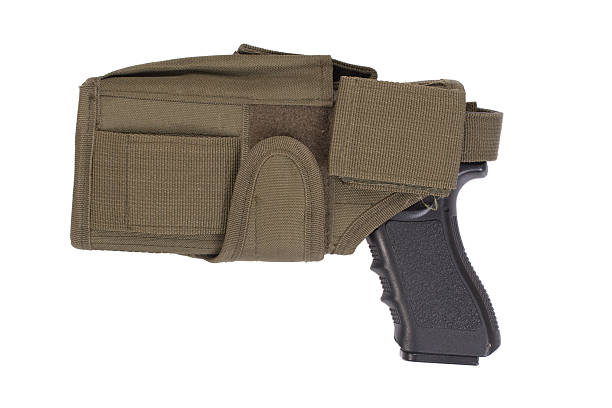 istock hand gun and tactical hoster isolated on white background 518526337