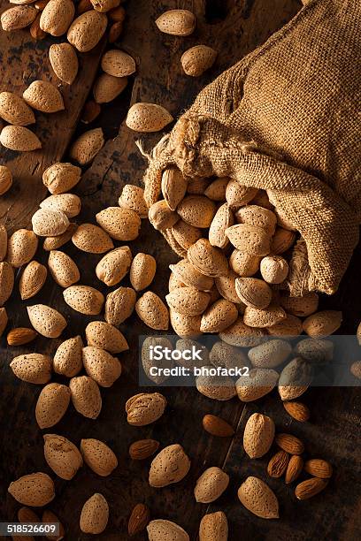 Raw Unshelled Organic Almonds Stock Photo - Download Image Now - Almond, Brown, Dry