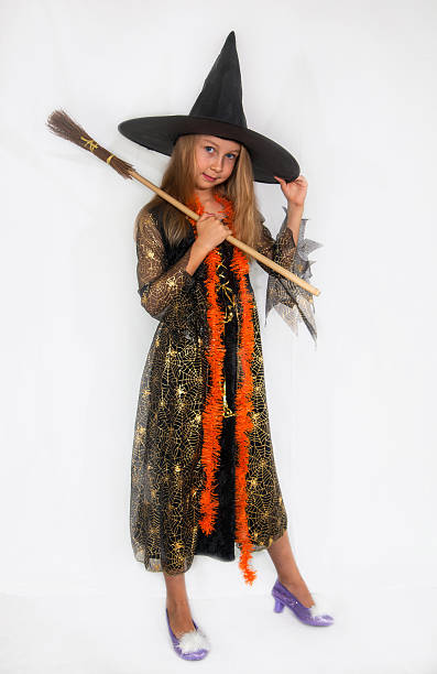 istock Girl posing in witch dress 518526899