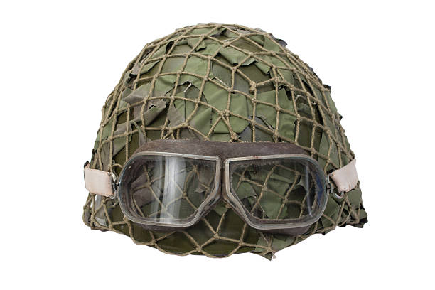 istock camouflage military helmet with goggles 518527265
