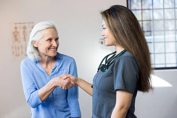 istock Senior Woman's Doctor's Office Visit 518527312