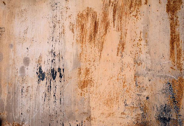 istock Texture of old wall covered with yellow stucco 518527745