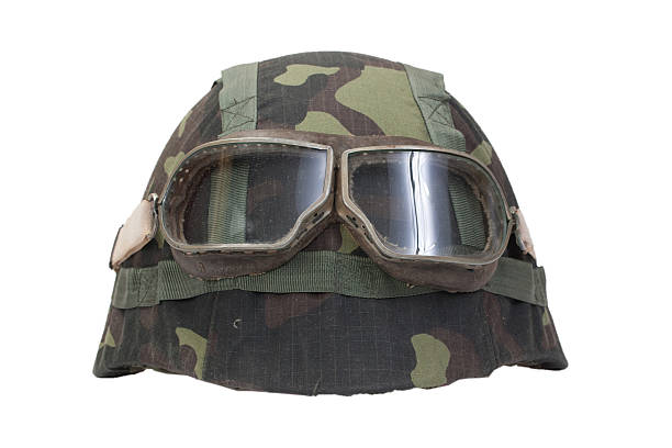 istock camouflage military helmet with goggles 518527939