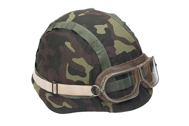 istock camouflage military helmet with goggles 518527983