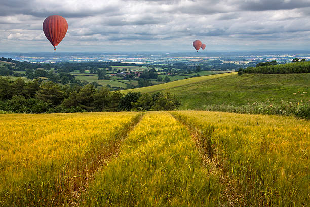 Hot Air Balloons over the East Yorkshire Wolds Hot air balloons drifting over the East Yorkshire Wolds in the United Kingdom yorkshire stock pictures, royalty-free photos & images