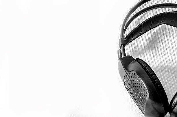istock headphones, black and white, on white background 518528427