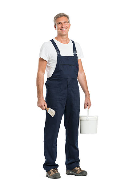 felice maturo pittore - manual worker full length isolated on white standing foto e immagini stock