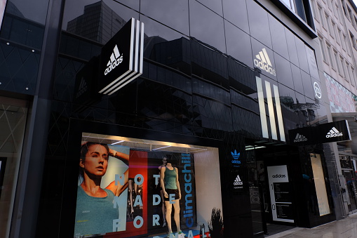 Frankfurt, Germany – March 30th, 2016: Adidas shop on the Zeil Street. Includes the Adidas logo and a window display. Adidas is a world famous footwear brand.