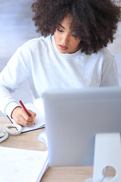 istock Young woman working at the office 518530178